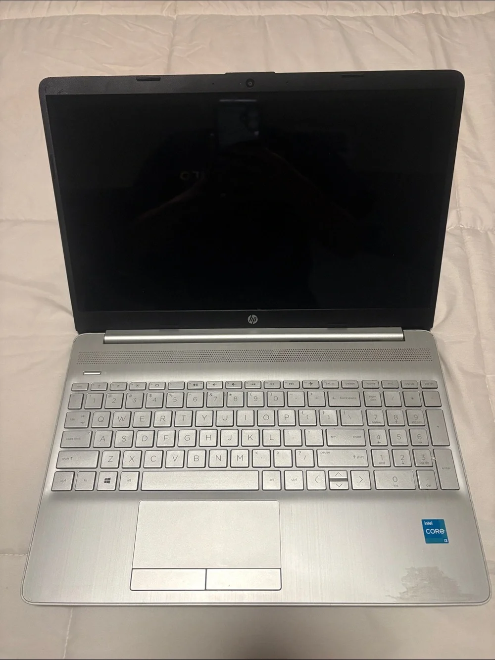 HP Silver Laptop with Charger and Sticker Accents